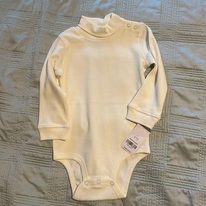 Carter’s cream colored baby onesie